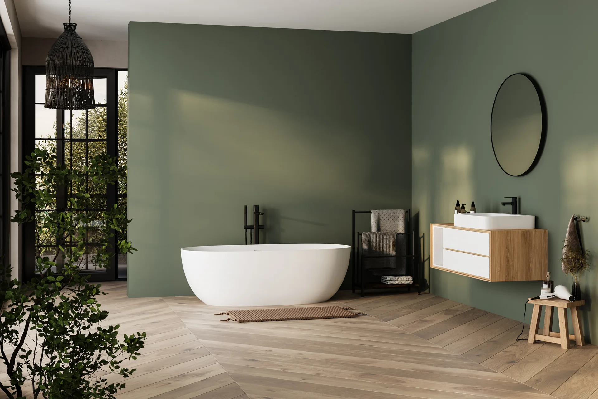 Freestanding bath against an olive wall with oak floor